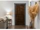 Welcoming entryway with a wooden door, stylish decor, and hardwood floors at 1171 Eggleston Sw St, Atlanta, GA 30310