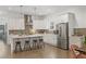 Well-lit modern kitchen with stainless steel appliances, island and barstool seating at 1171 Eggleston Sw St, Atlanta, GA 30310