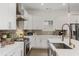 Bright modern kitchen with white cabinets and stainless steel appliances at 1171 Eggleston Sw St, Atlanta, GA 30310