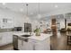 Open concept kitchen with island, stainless steel appliances, and pendant lighting at 1171 Eggleston Sw St, Atlanta, GA 30310