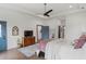 Bright main bedroom with ceiling fan and exterior door, includes hardwood floors and a calming color palette at 1171 Eggleston Sw St, Atlanta, GA 30310