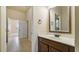 Bathroom vanity with a framed mirror, and a tiled floor at 5669 Casa Blanca Ln, Atlanta, GA 30331