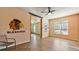 Bonus Room features a ceiling fan, windows, and Chicago Blackhawks themed wall art at 5669 Casa Blanca Ln, Atlanta, GA 30331