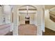 Empty dining room featuring an arched entryway and coffered ceiling at 5669 Casa Blanca Ln, Atlanta, GA 30331