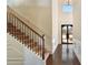 Bright foyer with hardwood floors, staircase, decorative trim and a view of the front door at 5669 Casa Blanca Ln, Atlanta, GA 30331