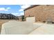 Side view of a home with a wide concrete driveway leading to an attached two-car garage at 5669 Casa Blanca Ln, Atlanta, GA 30331