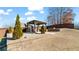 Outdoor gazebo with stone pillars on a grassy lawn in a fenced yard. There is a soft drink vending machine inside the gazebo at 5669 Casa Blanca Ln, Atlanta, GA 30331