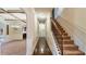 Spacious hallway with hardwood floors, staircase, and elegant trim leading to other rooms at 5669 Casa Blanca Ln, Atlanta, GA 30331