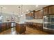 Well-equipped kitchen with dark wood cabinetry, granite counters, and stainless steel appliances at 5669 Casa Blanca Ln, Atlanta, GA 30331