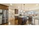 Open kitchen with stainless steel appliances, granite countertops, and a central island at 5669 Casa Blanca Ln, Atlanta, GA 30331