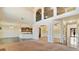 Expansive living area featuring high ceilings, archways, and seamless flow into the kitchen at 5669 Casa Blanca Ln, Atlanta, GA 30331