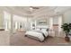 Large staged main bedroom featuring sitting area, tray ceilings, and lots of natural light at 5669 Casa Blanca Ln, Atlanta, GA 30331