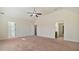 Spacious main bedroom featuring vaulted ceiling, neutral paint, carpet floors and multiple entry points at 5669 Casa Blanca Ln, Atlanta, GA 30331