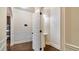 Elegant powder room featuring a pedestal sink, decorative mirror, and tasteful wall decor at 5669 Casa Blanca Ln, Atlanta, GA 30331