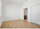 Light and airy bedroom with light colored floors and en-suite bathroom access at 675 Drewry Ne St # 201, Atlanta, GA 30306