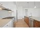 Bright kitchen with white cabinets, stainless steel appliances, and a kitchen island at 675 Drewry Ne St # 201, Atlanta, GA 30306