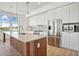 Modern kitchen with stainless steel appliances, wood grain island and stylish pendant lighting at 675 Drewry Ne St # 201, Atlanta, GA 30306