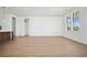 Spacious living room with hardwood floors, large windows, and neutral paint at 675 Drewry Ne St # 201, Atlanta, GA 30306