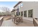 Lovely back deck featuring composite decking and a patio table with seating for four at 2953 Kings Walk Ave, Marietta, GA 30062