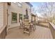 Outdoor deck with a dining table and seating overlooking the backyard at 2953 Kings Walk Ave, Marietta, GA 30062