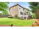 Expansive backyard featuring a multi-level deck, lush lawn, and mature trees, perfect for outdoor entertaining and relaxation at 2953 Kings Walk Ave, Marietta, GA 30062