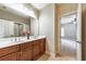 Bright bathroom featuring a dual sink vanity with dark wood cabinets and tile flooring at 2953 Kings Walk Ave, Marietta, GA 30062