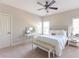 Relaxing bedroom features neutral colors, a ceiling fan, carpet, and a writing desk with a vanity mirror at 2953 Kings Walk Ave, Marietta, GA 30062