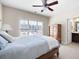 Bright bedroom featuring a neutral color palette, carpet, window with blinds, and ensuite access at 2953 Kings Walk Ave, Marietta, GA 30062