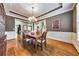 Charming dining room with hardwood floors, decorative wainscoting and large windows at 2953 Kings Walk Ave, Marietta, GA 30062