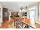 Bright dining area showcasing hardwood floors and chandelier lighting adjacent to the kitchen at 2953 Kings Walk Ave, Marietta, GA 30062