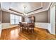 Elegant dining room with hardwood floors, wainscoting, and chandelier at 2953 Kings Walk Ave, Marietta, GA 30062