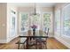 Bright dining room features a rustic table, decorative chandelier, and natural light at 2953 Kings Walk Ave, Marietta, GA 30062