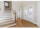 Bright foyer with hardwood floors, staircase and natural light from the front door at 2953 Kings Walk Ave, Marietta, GA 30062