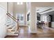 Inviting foyer with hardwood floors, staircase, and view to the dining room at 2953 Kings Walk Ave, Marietta, GA 30062