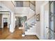 Spacious foyer featuring hardwood floors and staircase with white railings at 2953 Kings Walk Ave, Marietta, GA 30062