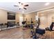 Well-equipped home gym featuring vinyl wood flooring, neutral paint, and various exercise machines at 2953 Kings Walk Ave, Marietta, GA 30062