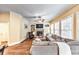 Comfortable living room featuring a fireplace, hardwood floors, and plenty of natural light at 2953 Kings Walk Ave, Marietta, GA 30062