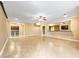 Open-concept living room with tan tile flooring, neutral paint and a ceiling fan at 2953 Kings Walk Ave, Marietta, GA 30062