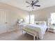 Cozy bedroom features neutral tones, a ceiling fan, and natural light from the window at 2953 Kings Walk Ave, Marietta, GA 30062