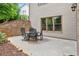 Cozy patio area with outdoor dining set and brick wall, perfect for enjoying meals and gatherings in a private setting at 2953 Kings Walk Ave, Marietta, GA 30062