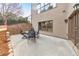 A view of the concrete patio with a table and seating and view of landscaped backyard at 2953 Kings Walk Ave, Marietta, GA 30062