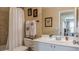 Bathroom with a shower, toilet, and white vanity with a white sink at 3673 Howard Dr, College Park, GA 30337