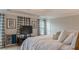 Bedroom with ceiling fan, tray ceiling, large bed, and gray curtains framing the windows at 3673 Howard Dr, College Park, GA 30337