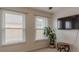 Bedroom with natural light from two large windows and neutral walls at 3673 Howard Dr, College Park, GA 30337