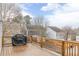 View of the cozy deck with a grill and wooden railing overlooking the neighborhood at 3673 Howard Dr, College Park, GA 30337