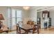 Dining area featuring hardwood floors, classic decor, and a view into the adjacent living room at 3673 Howard Dr, College Park, GA 30337