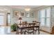 Dining room features classic decor, a wooden table with six chairs, and ample natural light from windows at 3673 Howard Dr, College Park, GA 30337