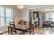 Dining room offering hardwood floors, crown molding, and a view into the living room with fireplace at 3673 Howard Dr, College Park, GA 30337