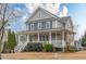 Charming two-story home with a welcoming front porch and manicured landscaping at 3673 Howard Dr, College Park, GA 30337