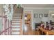 Inviting foyer with hardwood floors and a staircase leading to the second floor at 3673 Howard Dr, College Park, GA 30337